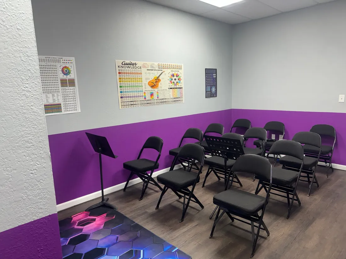The RockStar classroom with student chairs, music stands and theory posters